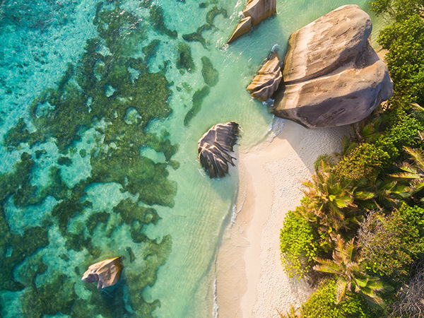 Aerial photo of Seychelles tropical beach Anse Source D Argent at La Digue island